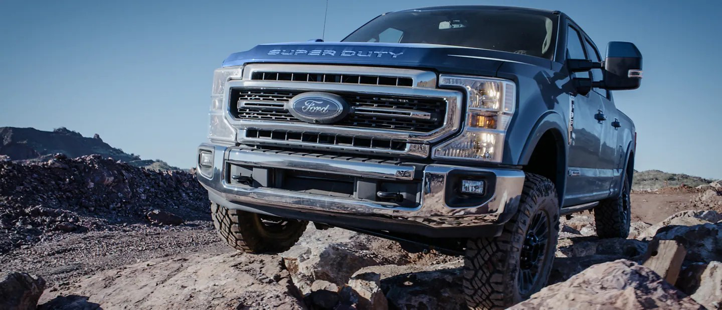 A Ford Super Duty climbing a steep mountain road with ease.